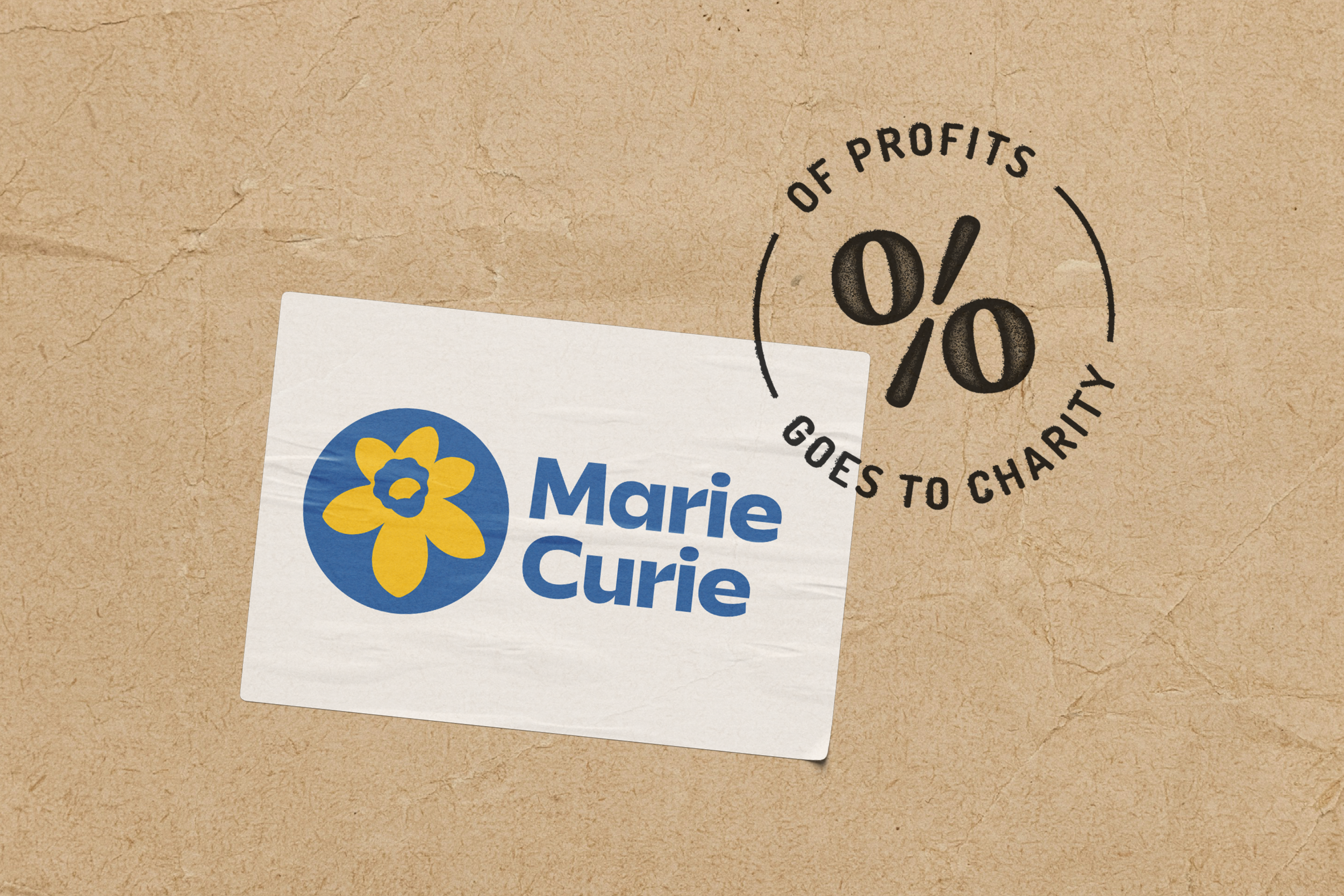 Marie Curie logo on a white card with '0% of profits goes to charity' text on brown paper background