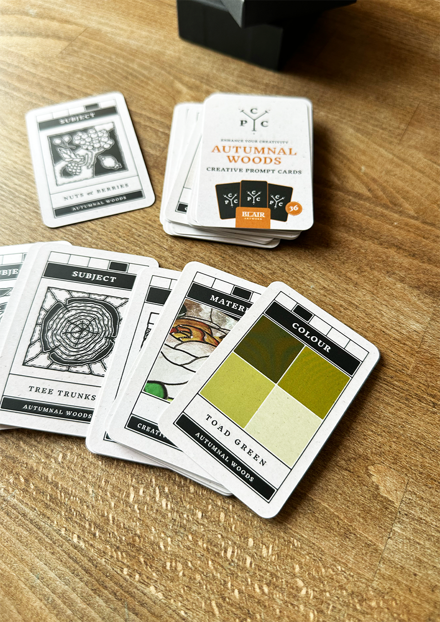 Set of cards with design elements on a wooden surface