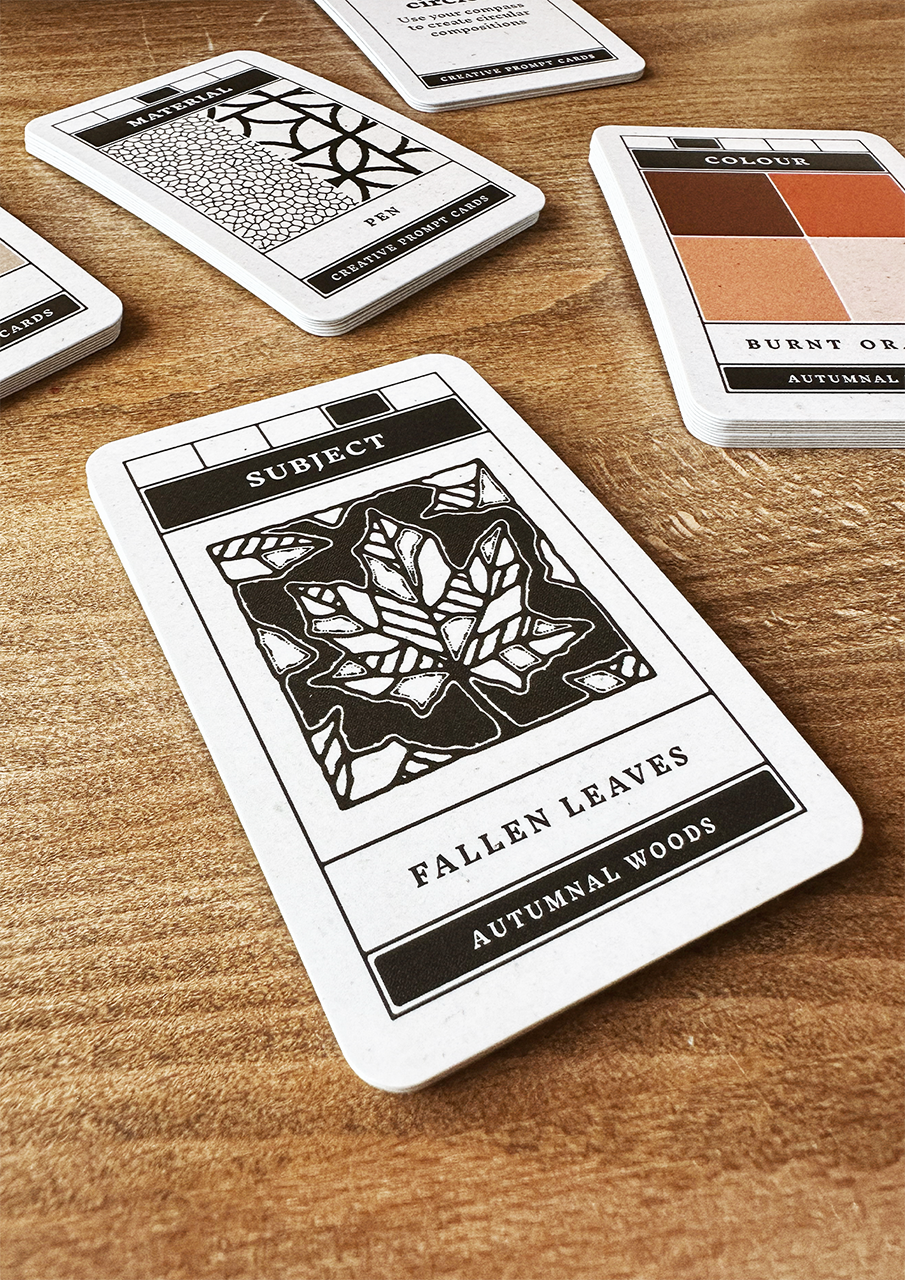 Card with 'Fallen Leaves' design on a wooden surface