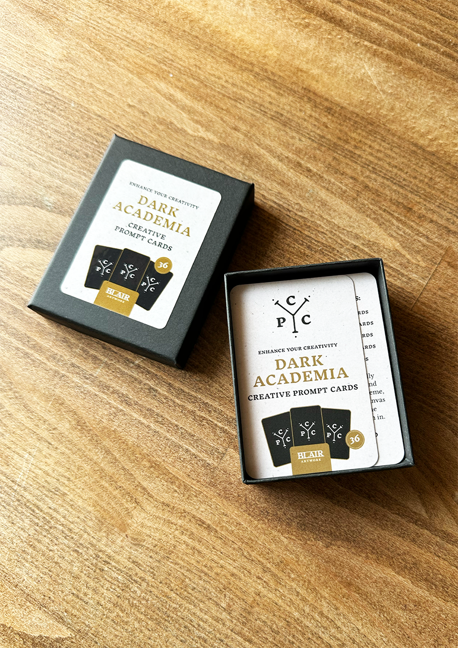 Dark Academia creative prompt cards in a box on a wooden surface
