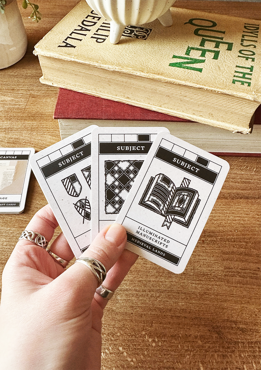 Hand holding playing cards with book design on a wooden surface with books in the background