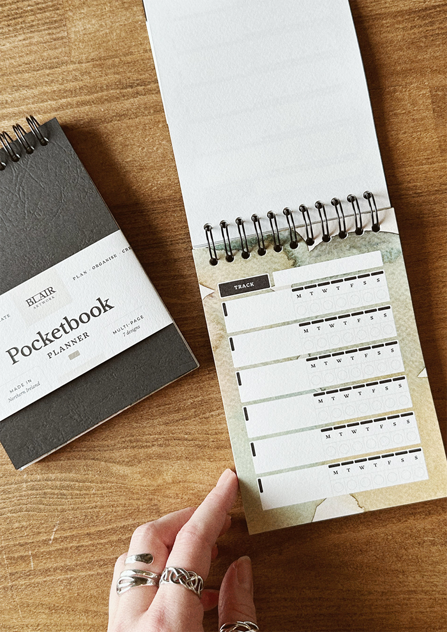 Open pocket book on wooden table