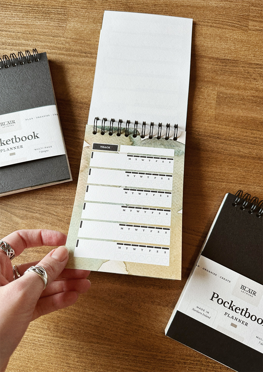 Open pocket book on wooden table