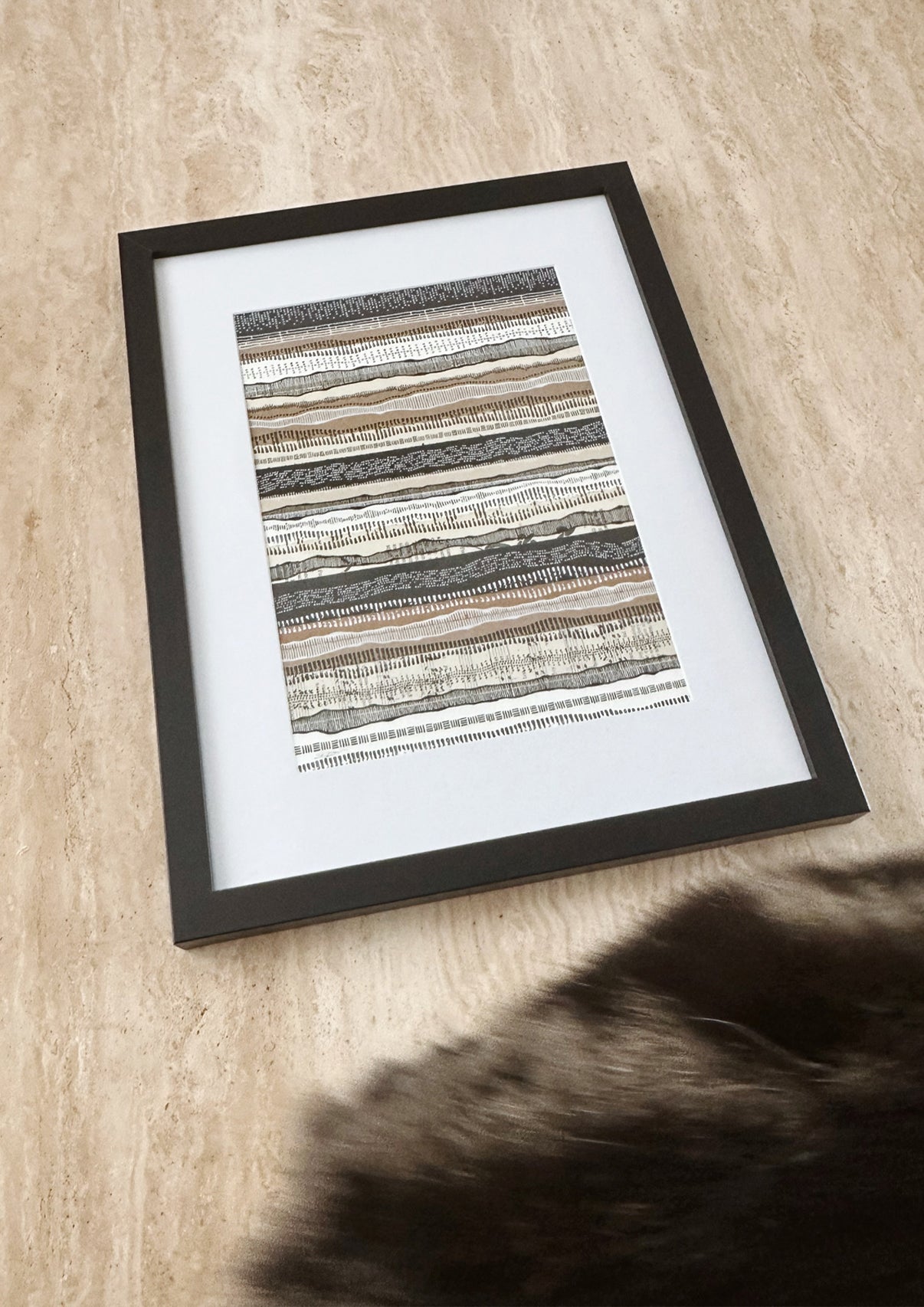 Art pattern of dots and lines in frame on marble table with cat fur
