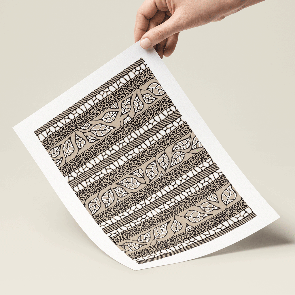 Illustration of leaves in white, black and brown print in hand