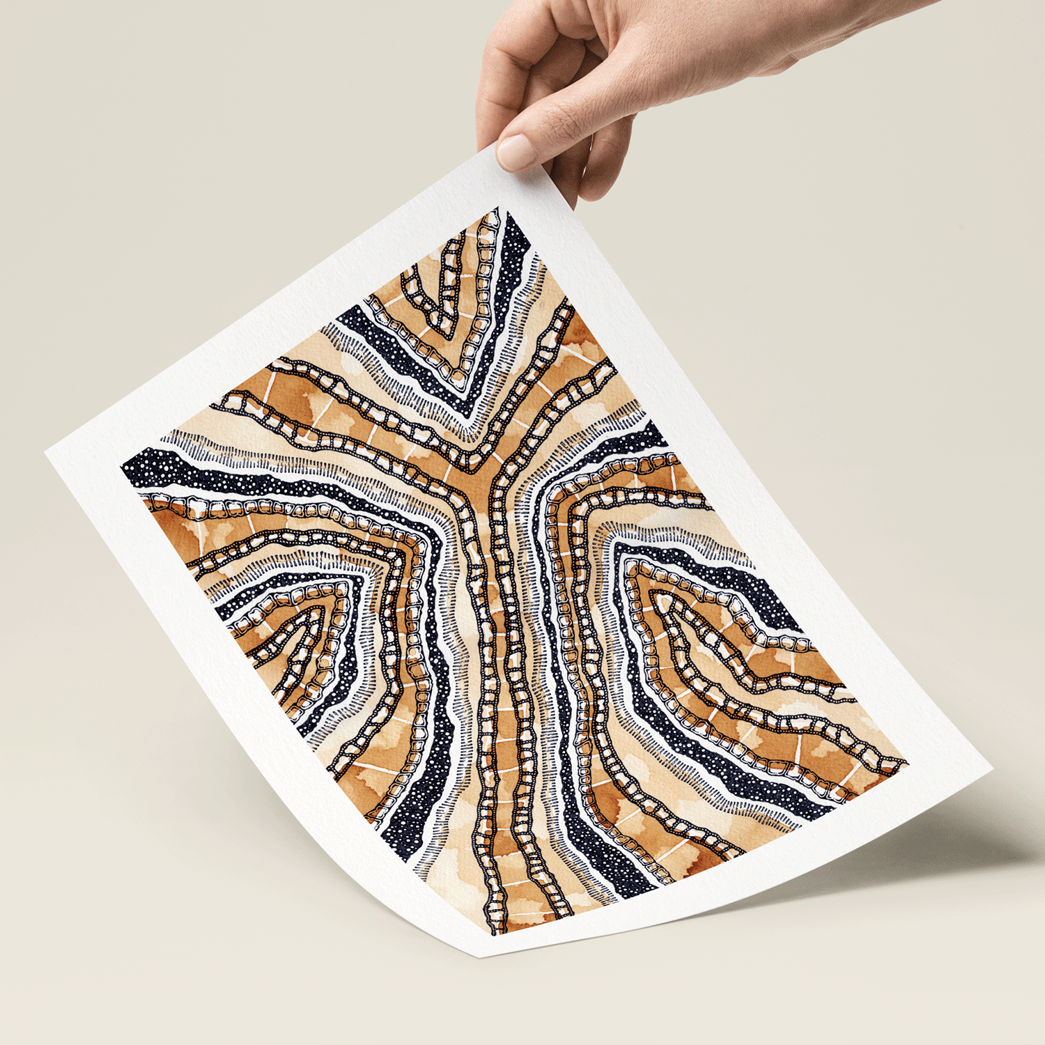 Abstract illustration in orange black and white print held in hand