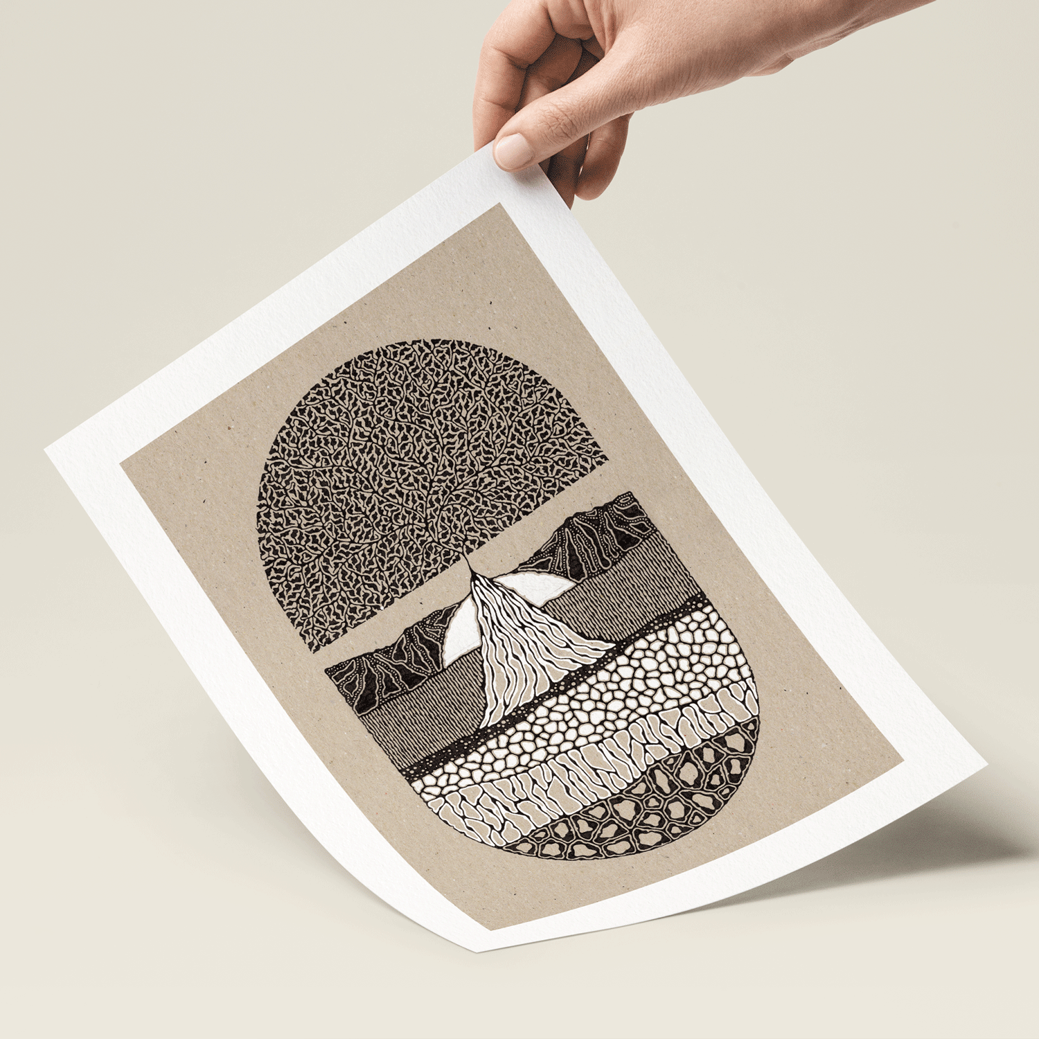 Tree illustration in black and brown and white print held in hand