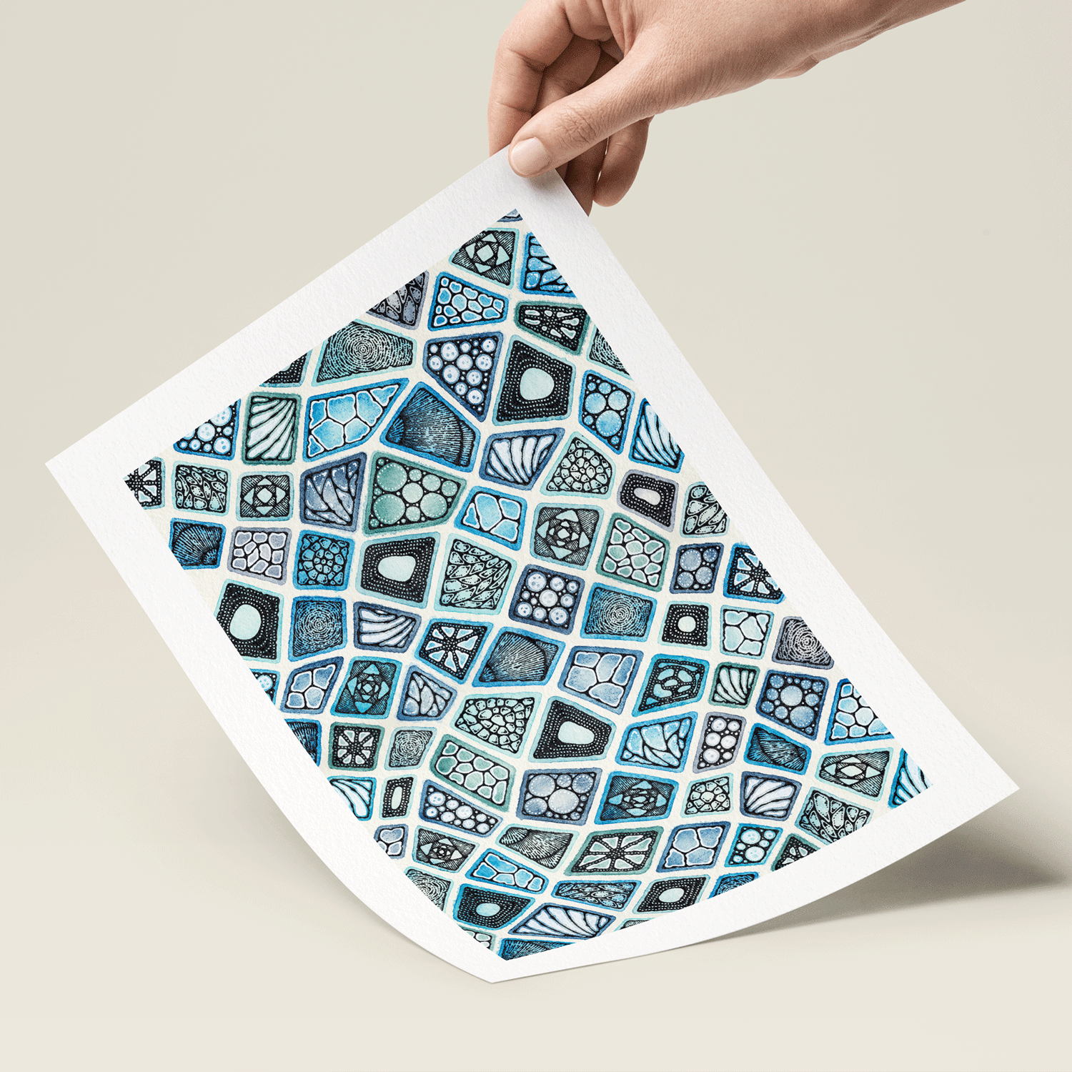 Hand holding colourful blue pattern art 