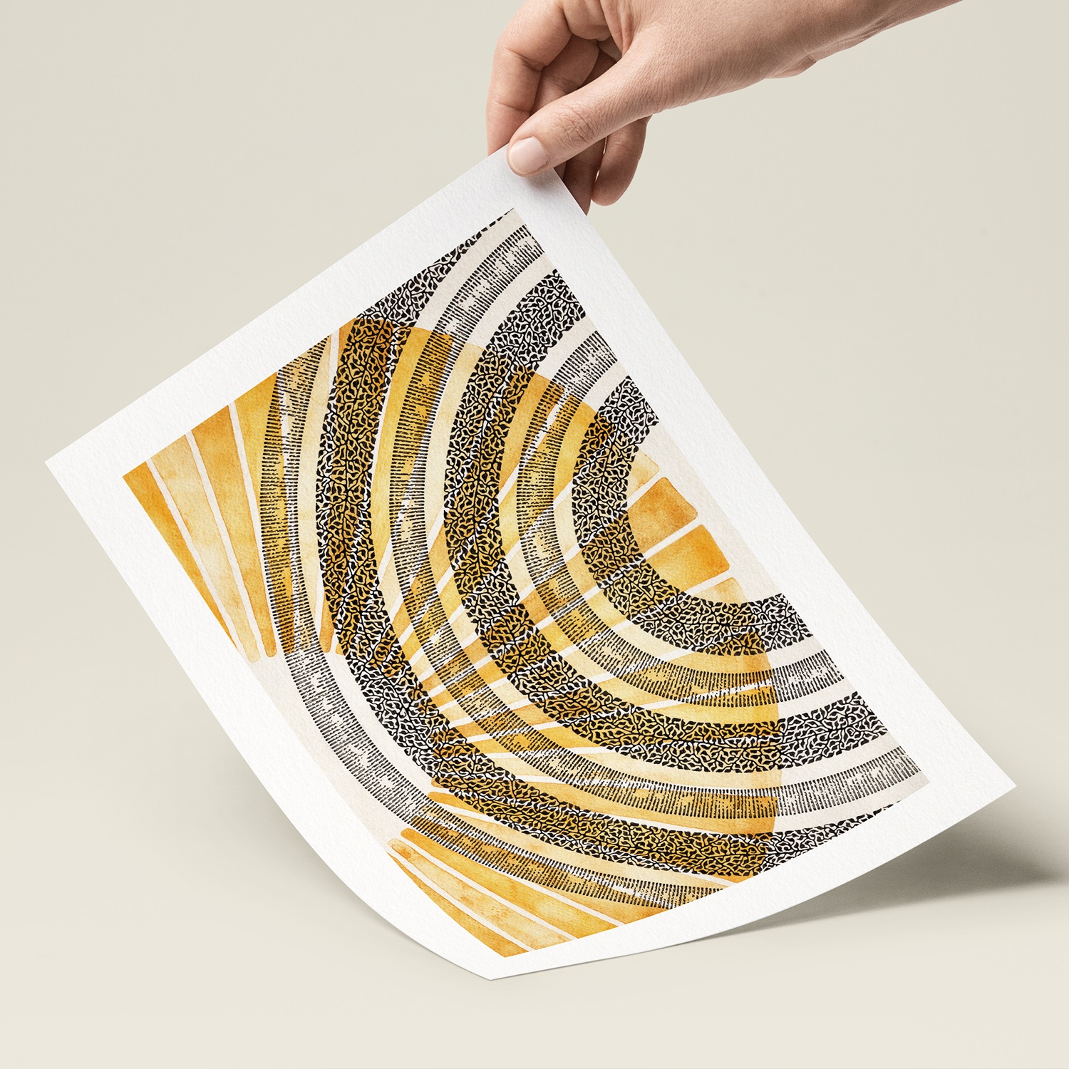 Hand holding a piece of paper with a geometric pattern on a beige background