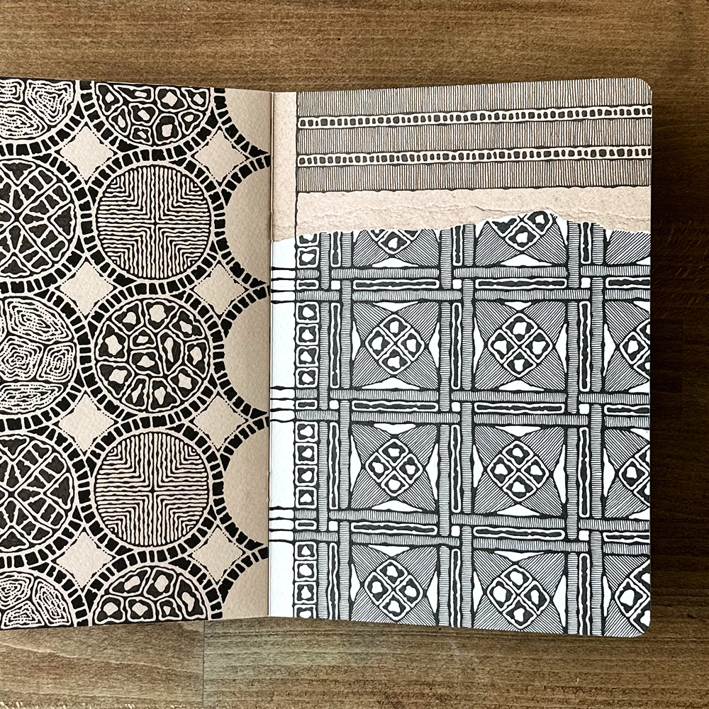 Two patterned pages on a wooden surface