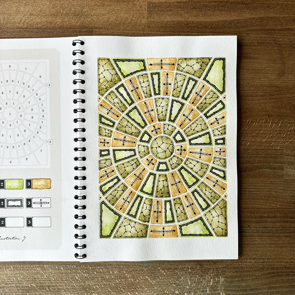 Open notebook with a geometric design on a wooden surface