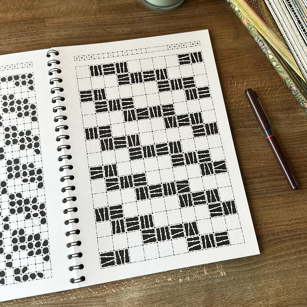 Notebook with geometric pattern on a wooden surface
