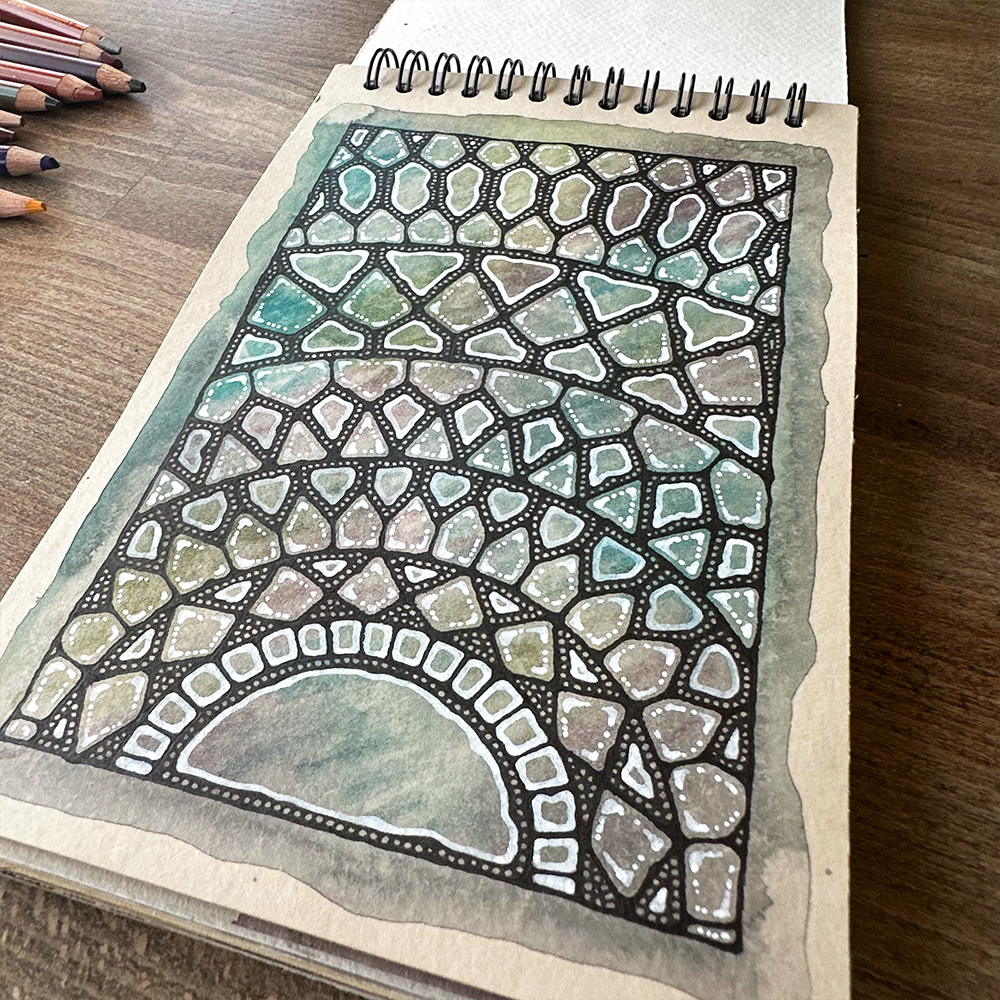 Coloring book with a mosaic design on a wooden surface