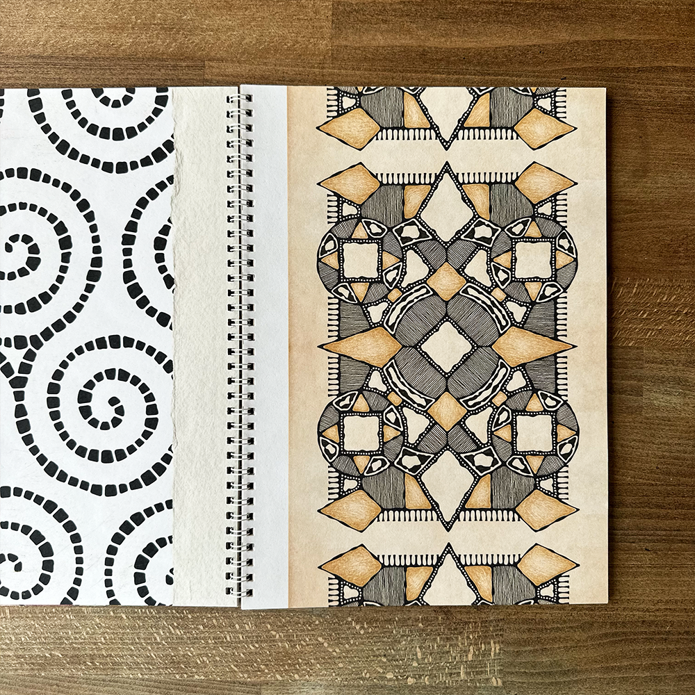 Open book with geometric pattern on a wooden surface
