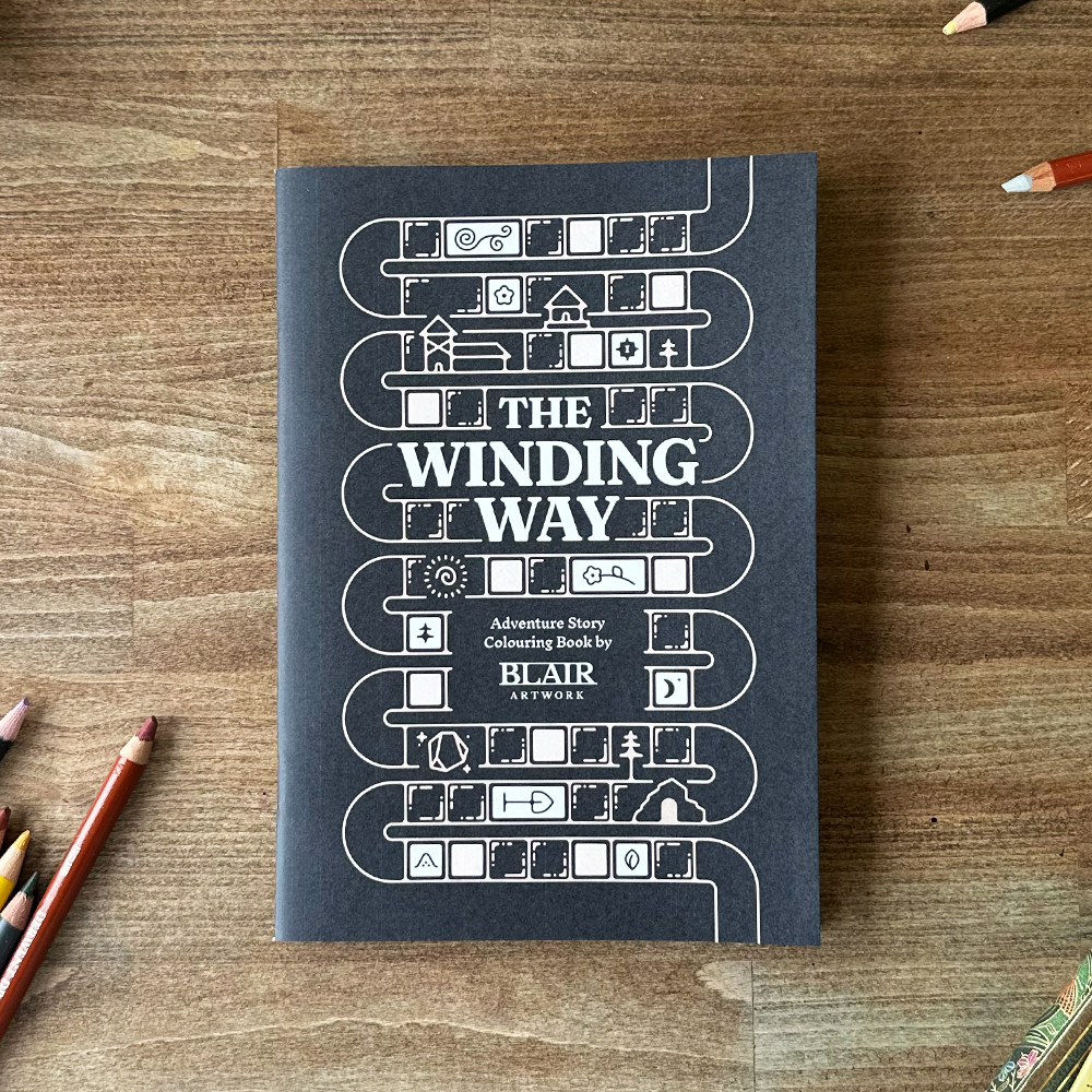 Book titled 'The Winding Way' on a wooden surface with pencils around