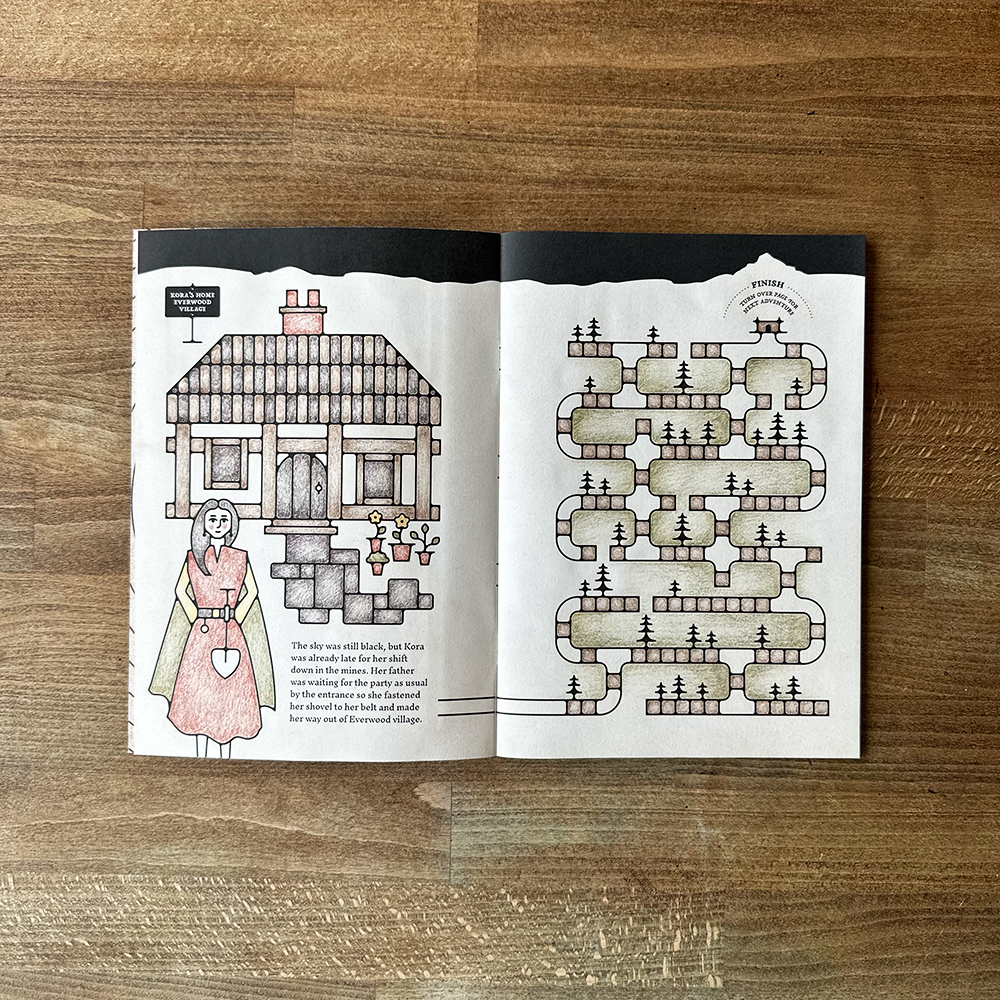 Open book with illustrations on a wooden surface